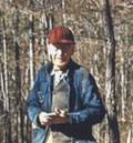 Fred W. Besley working in his forest during his retirement years