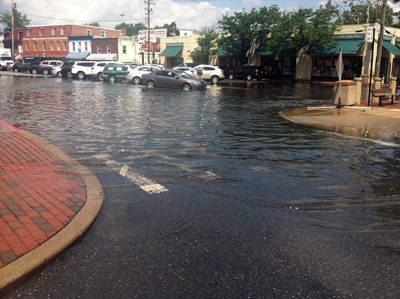 A photo of downtown Annapolis parking area which is flooded.