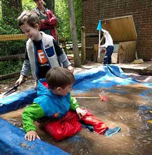 Playing in water at Audubon Pre-K