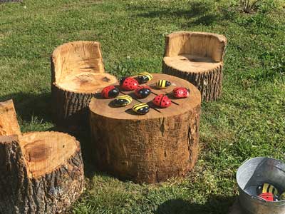 Game board with chairs made from tree sections