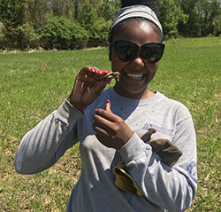 MCC crew member with small turtle