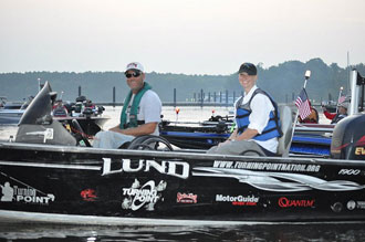 Photo of participants on a bass boat