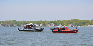 Natural Resources Police officers conduct patrols on NRP’s newest boat, the 31-foot Harry L. George, alongside firefighting and rescue vessels.  