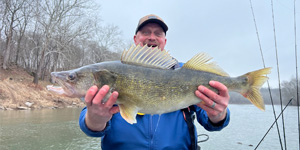 Bob Barber holds up a beautiful walleye from the upper Potomac River. Photo by Kevin Wilson