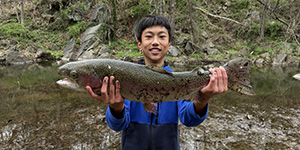 Eason Feng caught this large rainbow trout while fishing in the Patuxent River and catching this large rainbow trout.