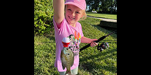 Everleigh Zerance is all smiles with her bluegill. Photo by Kayleigh Zerance