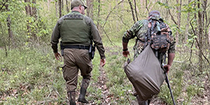 A Maryland Natural Resources Police officer inspects a turkey hunter in Somerset County during the spring turkey hunt. 