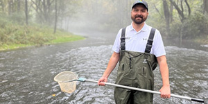 Secretary Josh Kurtz assists with a trout survey in the Gunpowder River.