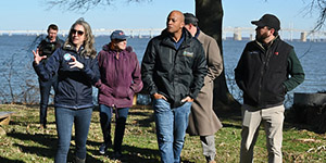 Secretary Josh Kurtz leads Gov. Wes Moore and Comptroller Brooke Lierman on a 2024 tour of what is now Holly Beach Natural Resources Management Area. Maryland Department of Natural Resources photo