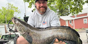 Matt Foreman of Crownsville holds the state record Chesapeake Channa, a 21.8-pound fish caught June 7, 2025. Photo courtesy Matt Foreman.