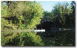 Kayaks paddling by a bridge in western Maryland