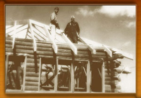 Kirk P. Rodgers with his grandfather, Fred W. Besley, atop the family cabin, which Besley built in 1949.