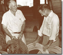 A.R. "Pete" Bond (right) in tobacco barn.