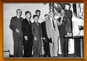 Charles County Forestry Board. Group of men and boys with one boy standing on a table.