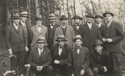 Fred W. Besley and his foresters posing in the field