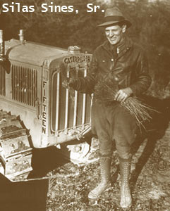 Silas Sines, standing in front of a tractor. Silas was head nurseryman at the state tree nursery from 1929-1974