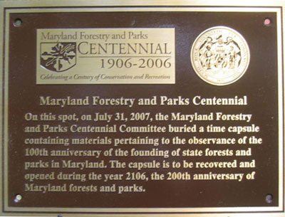 The final Centennial Plaque marking the spot where the Centennial Time Capsule is now buried at Gambrill State Park