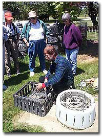 Waterman showing two types of whelk pots