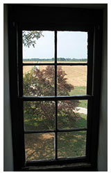 Scene through window inside the Old Bohemia house.