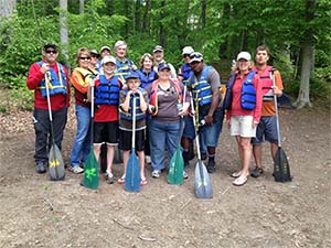 Volunteers with paddles image