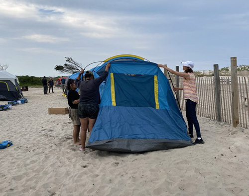 In 2024, the community group Defensores de la Cuenca used tents and gear purchased with a Maryland Outdoor Equity Grant for a group camping trip at Assateague State Park.