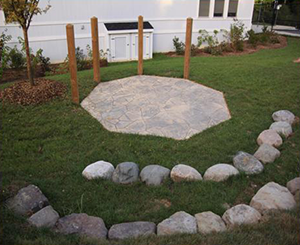 Stage with stone seating at Musical instruments at Brick path at Johns Hopkins Homewood Early Learning Center