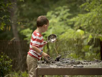 Kid playing in the mud