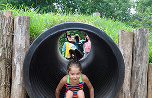 Young girl in slide at Robinson Nature Center