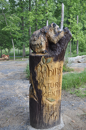 Robinson_Wood-Carvings-Mark-the-Entry.png