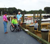 A man in a wheelchair on a dock.