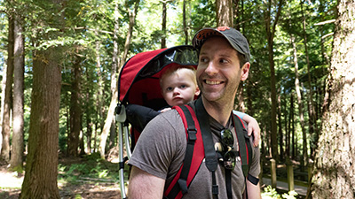 A father and his young son out on a trail.