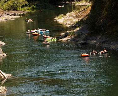 People tubing down a river