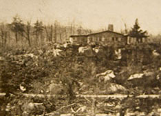 Historic Rock Lodge above devastated forest landscape