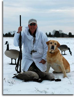 Wildlife biologist Larry Hindman with his 2-bag AP Canada Goose limit and his retriever