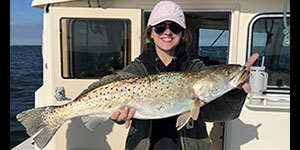 Sarah Yow holds up a beautiful speckled trout she caught in  Tangier Sound. Photo courtesy of Sarah Yow