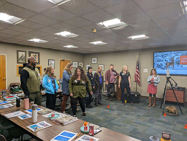 Trainees learn activities to help teach others, like this game called “Oh Deer” from Project WILD. Photo by Edwin Guevara.